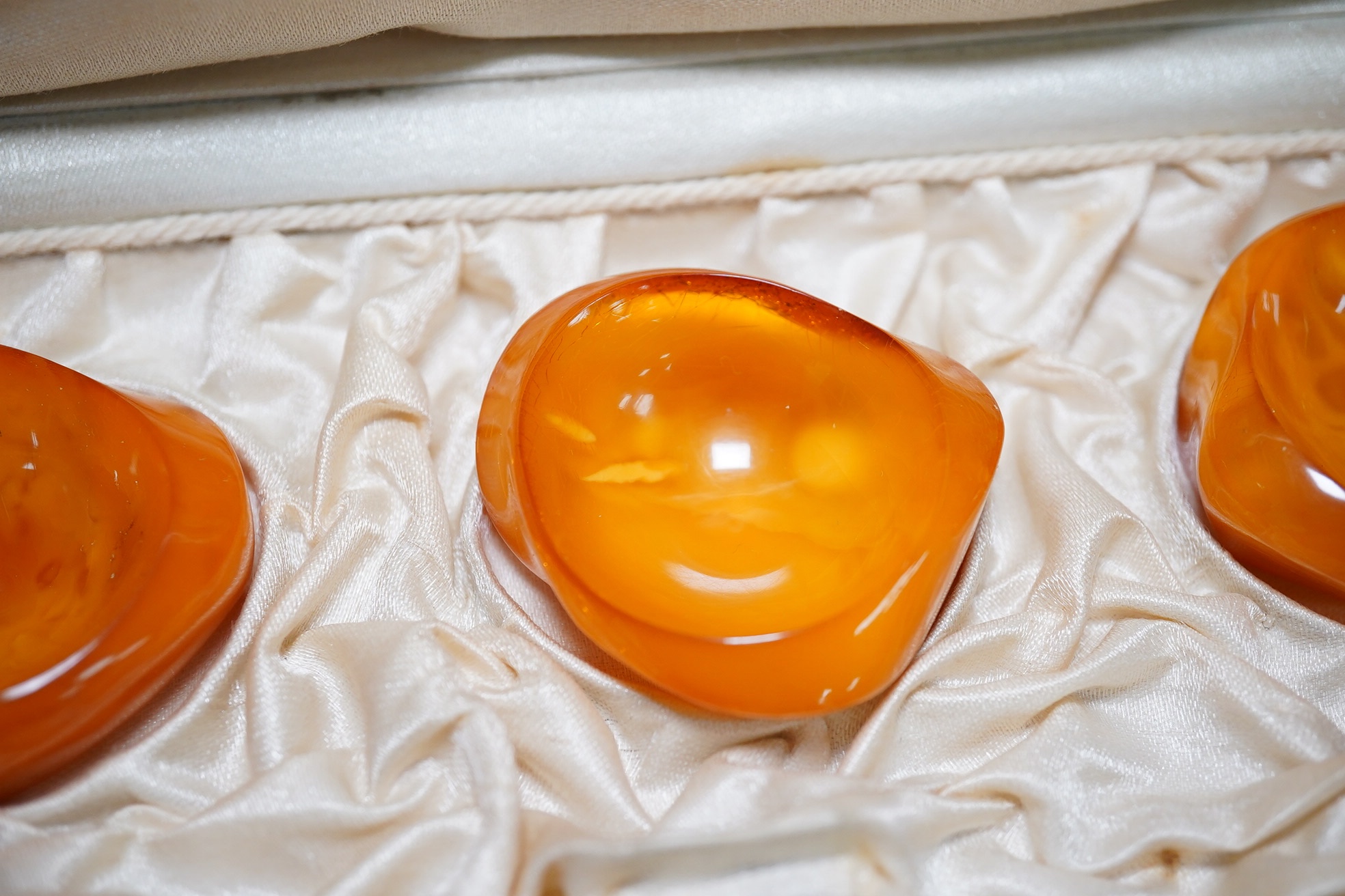 A group of assorted amber and other jewellery including carnelian necklace, glass bead necklace, aquamarine pebble necklace, etc. Condition - fair